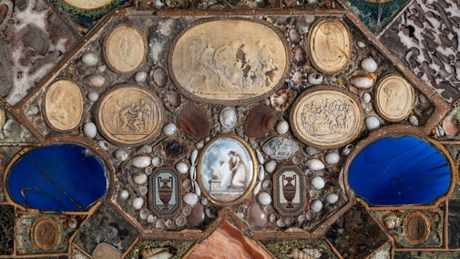 Detail of the interior of a painted and decorated octagonal work table at A la Ronde, Devon.